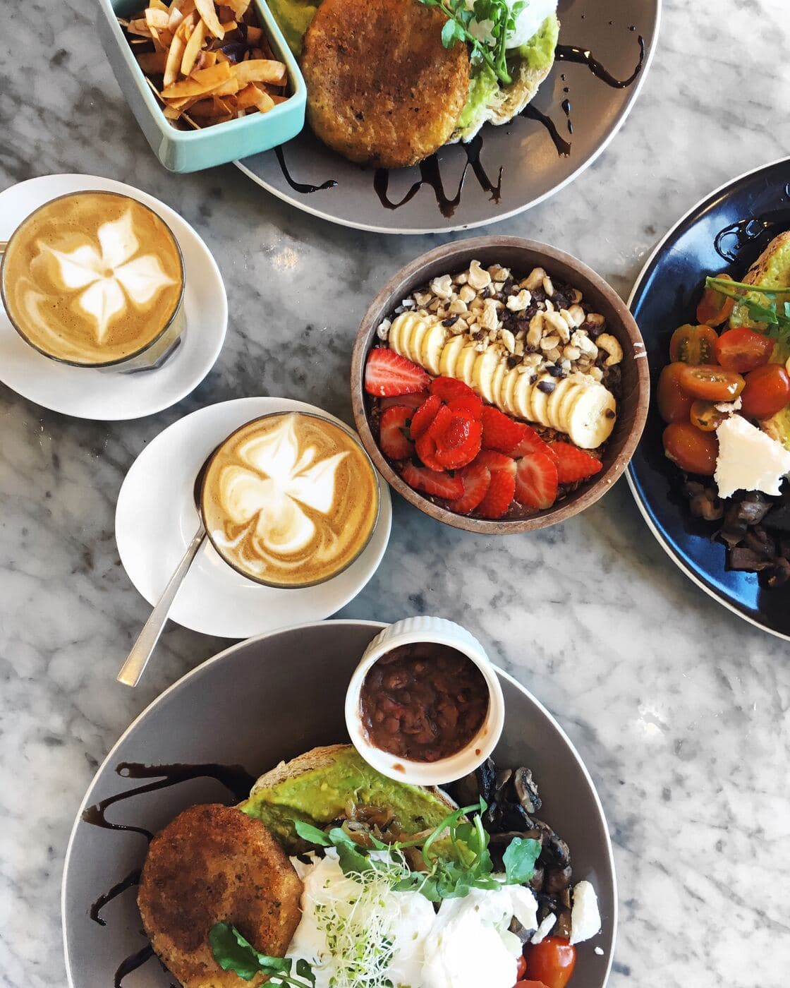 Colourful Bali brunch spread with coffee and fresh fruit