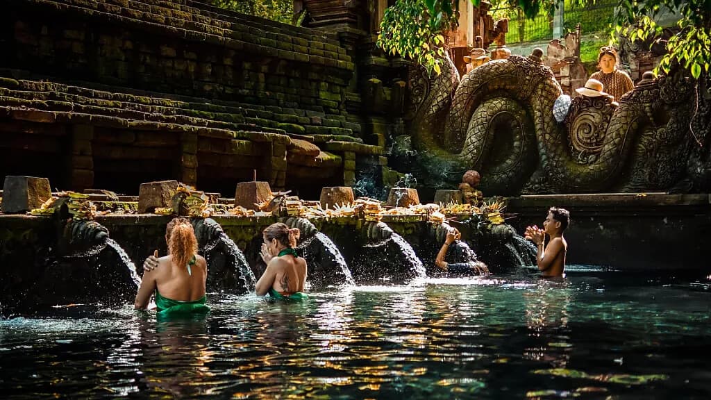 Travellers taking part in a Balinese water purification ritual