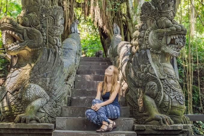 Moss-covered statues in Ubud's Monkey Forest